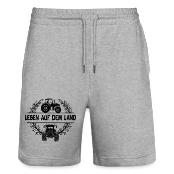 Leben auf dem Land with tractor and wheat wreath - Stanley/Stella Trainer Unisex Organic Jogging Shorts - heather grey - Front - Nik (191cm) & Marisol (170cm)