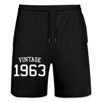 Jahrgang 1963, 60 Jahre alt, Geschenk zum 60. Geburtstag - Stanley/Stella Unisex Bio Joggingshorts Trainer  - Schwarz - Vorne - Nik (191cm) & Marisol (170cm)