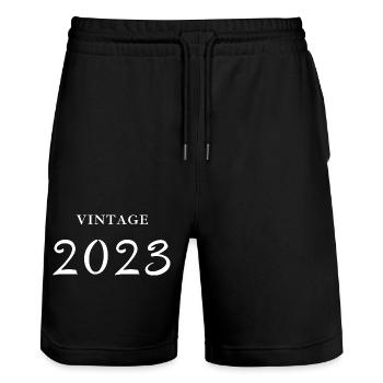 Jahrgang 2023-Geschenkidee zum Geburtstag - Stanley/Stella Unisex Bio Joggingshorts Trainer  - Schwarz - Vorne - Nik (191cm) & Marisol (170cm)
