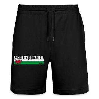 Merthyr Tydfil: Walisisches Erbe und landschaftliche Schönheit - Stanley/Stella Unisex Bio Joggingshorts Trainer  - Schwarz - Vorne - Nik (191cm) & Marisol (170cm)