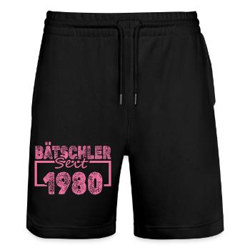 Bachelor 1980 - Stanley/Stella Trainer Unisex Organic Jogging Shorts - black - Front - Nik (191cm) & Marisol (170cm)