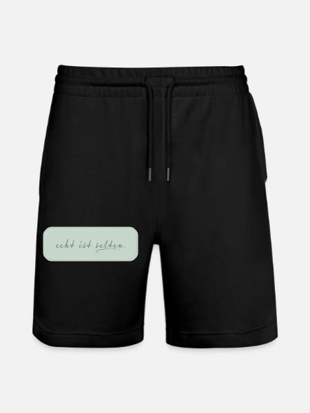 echt ist selten – minimalistische Typografie - Stanley/Stella Unisex Bio Joggingshorts Trainer  - Schwarz