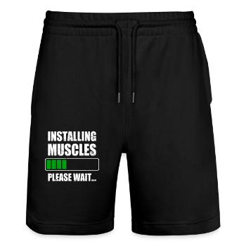 L’installation des muscles muscles installe l’entraînement au gymnase - Short de jogging bio TRAINER Stanley/Stella unisexe - noir - Devant - Nik (191cm) & Marisol (170cm)