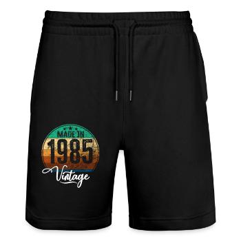 Millésime Fabriqué en 1985 Année de naissance 1985 Anniversaire - Short de jogging bio TRAINER Stanley/Stella unisexe - noir - Devant - Nik (191cm) & Marisol (170cm)