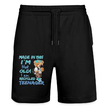 1985 Birthday Teddy funny old teenager - Stanley/Stella Trainer Unisex Organic Jogging Shorts - black - Front - Nik (191cm) & Marisol (170cm)