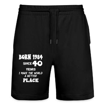Jahrgang 1984, seit 40 Jahren, mache ich 40. Geburtstags-Motiv - Stanley/Stella Unisex Bio Joggingshorts Trainer  - Schwarz - Vorne - Nik (191cm) & Marisol (170cm)