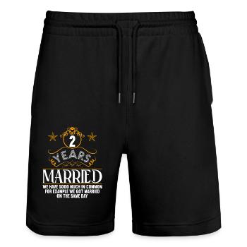 Nous avons beaucoup de choses en commun 2ème anniversaire de mariage - Short de jogging bio TRAINER Stanley/Stella unisexe - noir - Devant - Nik (191cm) & Marisol (170cm)