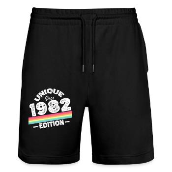 Unique depuis 1982 Edition Anniversaire Millésime 1982 - Short de jogging bio TRAINER Stanley/Stella unisexe - noir - Devant - Nik (191cm) & Marisol (170cm)