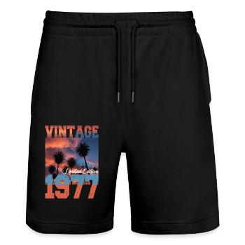 1977 Vintage Edition Limitée Palmiers Né en 1977 - Short de jogging bio TRAINER Stanley/Stella unisexe - noir - Devant - Nik (191cm) & Marisol (170cm)