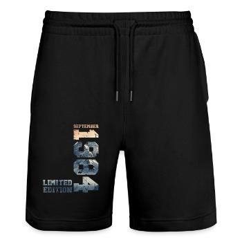 40th Birthday Original September 1984 Volume 84 - Stanley/Stella Trainer Unisex Organic Jogging Shorts - black - Front - Nik (191cm) & Marisol (170cm)