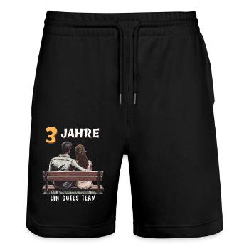 3 ANS D’UNE BONNE ÉQUIPE HOMME FEMME - Short de jogging bio TRAINER Stanley/Stella unisexe - noir - Devant - Nik (191cm) & Marisol (170cm)