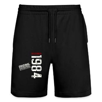 40th Birthday Legend December 1984 Volume 84 - Stanley/Stella Trainer Unisex Organic Jogging Shorts - black - Front - Nik (191cm) & Marisol (170cm)