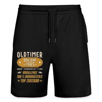 Vintage Model 1985 Vintage Retro funny Design - Stanley/Stella Trainer Unisex Organic Jogging Shorts - black - Front - Nik (191cm) & Marisol (170cm)