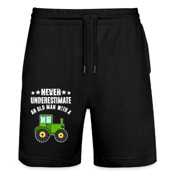 Never Underestimate Traktor - Stanley/Stella Unisex Bio Joggingshorts Trainer  - Schwarz - Vorne - Nik (191cm) & Marisol (170cm)