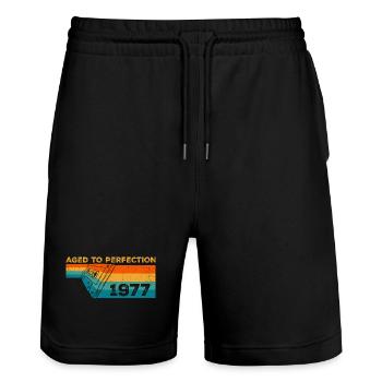 Jahrgang 1977 - Retro 1977 Geburtstagsgeschenk - Stanley/Stella Unisex Bio Joggingshorts Trainer  - Schwarz - Vorne - Nik (191cm) & Marisol (170cm)