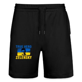 Ukraine - Der wahre Held Selenskyj gegen  - Stanley/Stella Unisex Bio Joggingshorts Trainer  - Schwarz - Vorne - Nik (191cm) & Marisol (170cm)