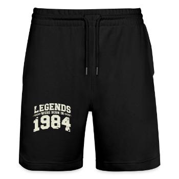 1984 Vintage Born Legends Cadeau d’anniversaire - Short de jogging bio TRAINER Stanley/Stella unisexe - noir - Devant - Nik (191cm) & Marisol (170cm)