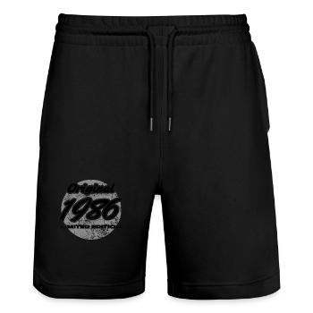 40. Geburtstag 1986 Geschenk für Männer und Frauen - Stanley/Stella Unisex Bio Joggingshorts Trainer  - Schwarz - Vorne - Nik (191cm) & Marisol (170cm)