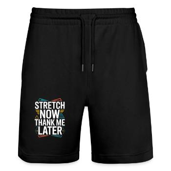 Un thérapeute de la main s’étire maintenant pour remercier le kinésithérapeute - Short de jogging bio TRAINER Stanley/Stella unisexe - noir - Devant - Nik (191cm) & Marisol (170cm)