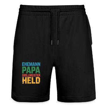 Papa Ehemann Grillheld Grillmeister Geschenk - Stanley/Stella Unisex Bio Joggingshorts Trainer  - Schwarz - Vorne - Nik (191cm) & Marisol (170cm)