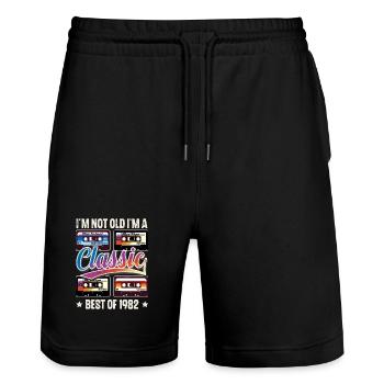 1982 Geburtsjahr Geburtstag Kassette Vintage - Stanley/Stella Unisex Bio Joggingshorts Trainer  - Schwarz - Vorne - Nik (191cm) & Marisol (170cm)
