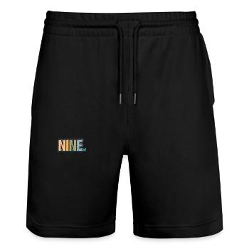 9e anniversaire Enfants Neuf ans - Short de jogging bio TRAINER Stanley/Stella unisexe - noir - Devant - Nik (191cm) & Marisol (170cm)