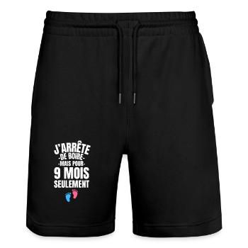 Lustige Schwangerschaftsankündigung - Humor Werdende Mama 2026 - Stanley/Stella Unisex Bio Joggingshorts Trainer  - Schwarz - Vorne - Nik (191cm) & Marisol (170cm)
