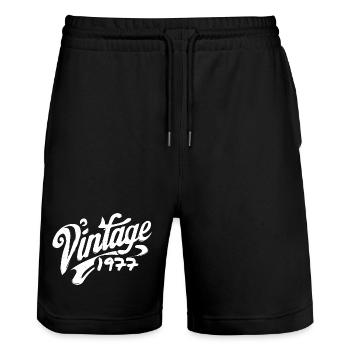 Vintage 1977 Jahrgang 1977 Geburtstag 1977 Retro - Stanley/Stella Unisex Bio Joggingshorts Trainer  - Schwarz - Vorne - Nik (191cm) & Marisol (170cm)