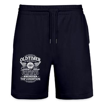 Oldtimer Baujahr 1985 Jahrgang Geburtstag Geschenk - Stanley/Stella Unisex Bio Joggingshorts Trainer  - Dark navy - Vorne - Nik (191cm) & Marisol (170cm)