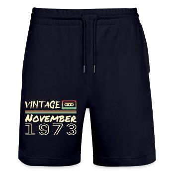 Legendary Since November 1973 - November 1973 - Stanley/Stella Trainer Unisex Organic Jogging Shorts - dark navy - Front - Nik (191cm) & Marisol (170cm)