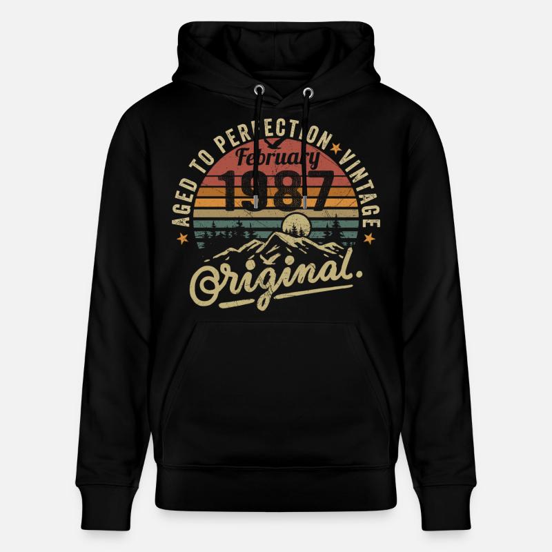 Février 1987 - Sweat à capuche bio CRUISER Stanley/Stella Unisexe - noir