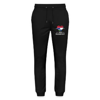 100 % amitié entre la Gambie et les Pays-Bas - Pantalon de jogging bio MOVER Stanley/Stella unisexe - noir - Devant - Marisol (170cm) & Nik (191cm)