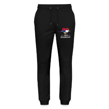 Armenien und Niederlande 100% Freundschaft - Stanley/Stella Unisex Bio Jogginghose Mover  - Schwarz - Vorne - Marisol (170cm) & Nik (191cm)