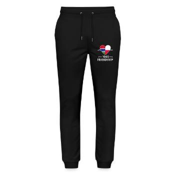 100 % amitié entre la Gambie et la Pologne - Pantalon de jogging bio MOVER Stanley/Stella unisexe - noir - Devant - Marisol (170cm) & Nik (191cm)