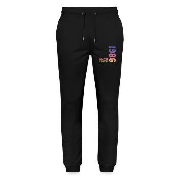 1986 Limited Edition Birthday - Stanley/Stella Mover Unisex Organic Jogging Trousers - black - Front - Marisol (170cm) & Nik (191cm)