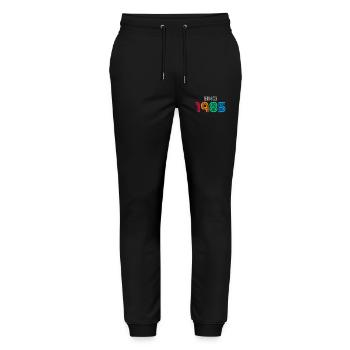 Seit 1985 | Vintage-Retro-Farbenes Jahr - Stanley/Stella Unisex Bio Jogginghose Mover  - Schwarz - Vorne - Marisol (170cm) & Nik (191cm)