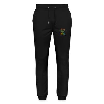 genius born 1985 - Pantalon de jogging bio MOVER Stanley/Stella unisexe - noir - Devant - Marisol (170cm) & Nik (191cm)