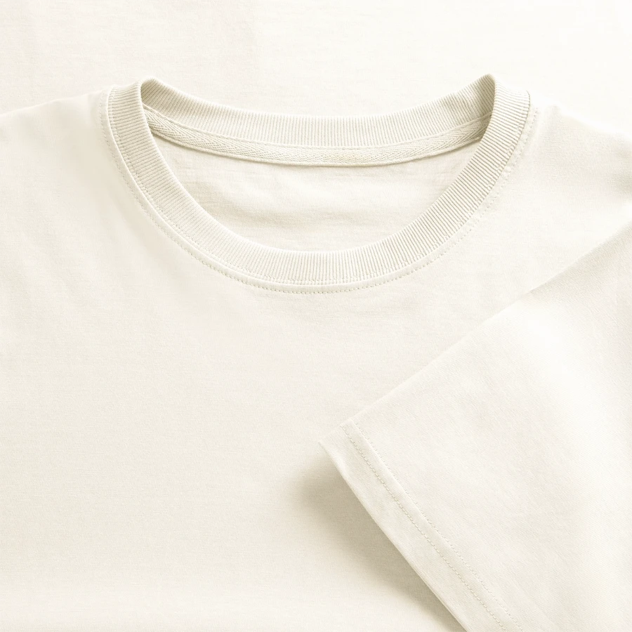 Montreux badge on a  relaxed fit unisex organic t-shirt, natural white, close-up