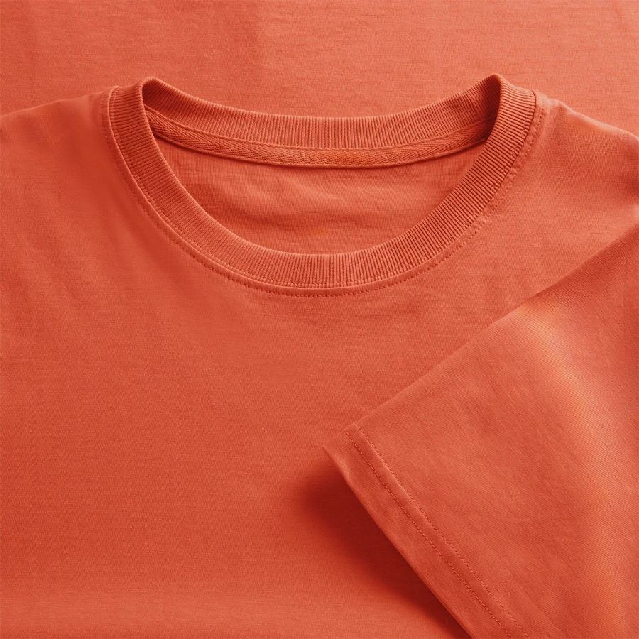 Florence badge on a  relaxed fit unisex organic t-shirt, light red, close-up