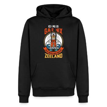 Ich muss gar nix ich muss nur nach Zeeland - Männer Premium Bio Hoodie - Schwarz - Vorne - Nico (187cm)