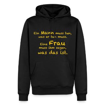 Ein Mann muss tun, was er tun muss. - Männer Premium Bio Hoodie - Schwarz - Vorne - Nico (187cm)