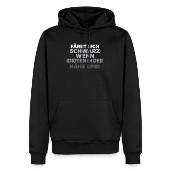 Färbt sich schwarz wenn Idioten in der Nähe sind - Männer Premium Bio Hoodie - Schwarz - Vorne - Nico (187cm)