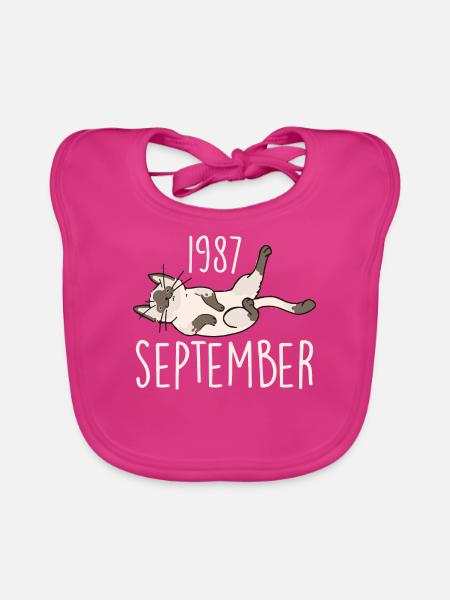 Bildunterschrift September 1987 Jubiläumsgeschenk 1987 - Baby Bio-Lätzchen - Fuchsia - Vorne