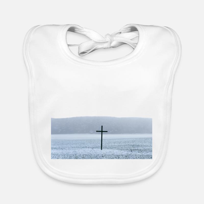 Big black cross on a field in winter Organic Baby Bibs