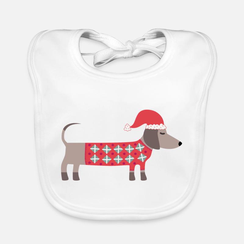 Chien teckel de Noël avec un chapeau de Père Noël et un pull Bavoir bio Bébé