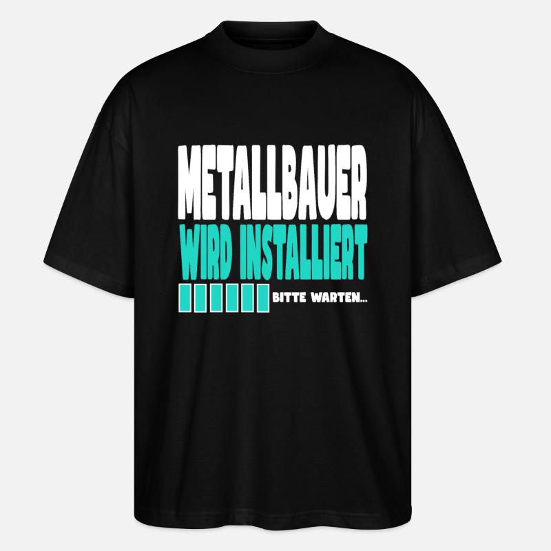 Metallbauer wird installiert - Stanley/Stella Oversized Unisex Bio T-Shirt Blaster 2.0 - Schwarz