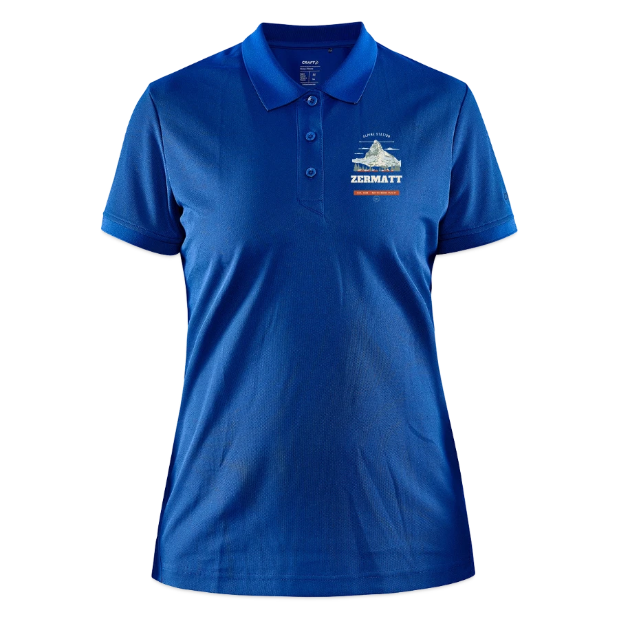 Zermatt badge on a craft core unify women's polo, deep royal