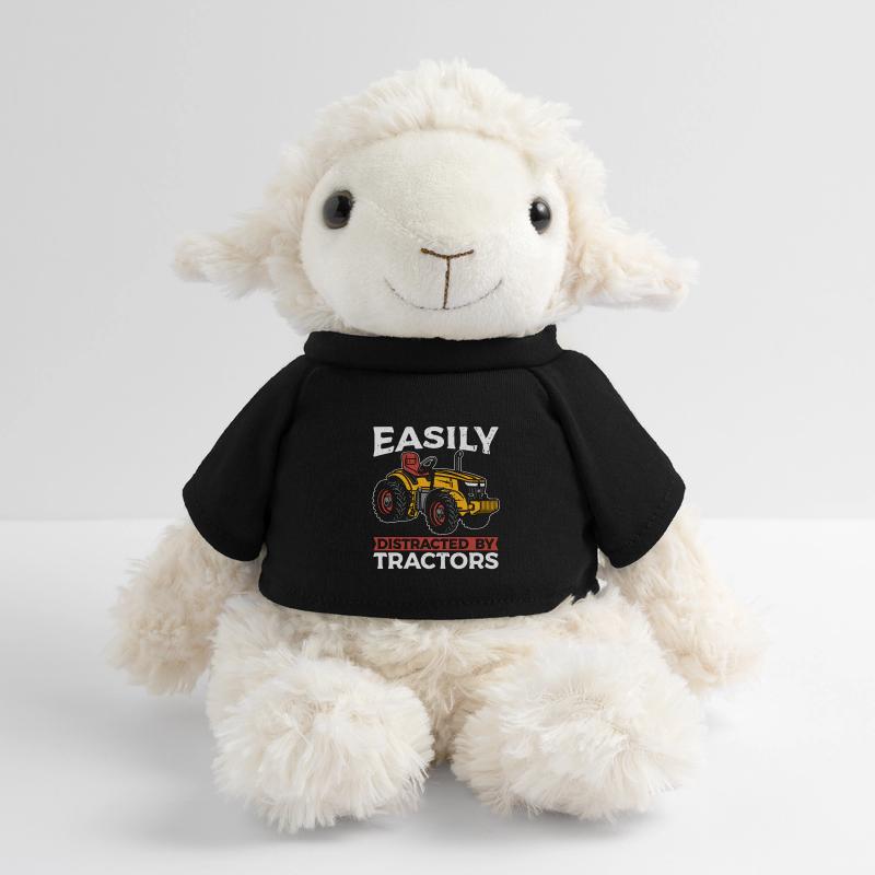 La moissonneuse est facilement distraite par une machine agricole Mouton en peluche Annika MiniFeet®