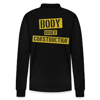 Body under Construction - Stanley/Stella Unisex Bio-Langarm-Poloshirt Prepster - Schwarz - Hinten - Anna (173cm)