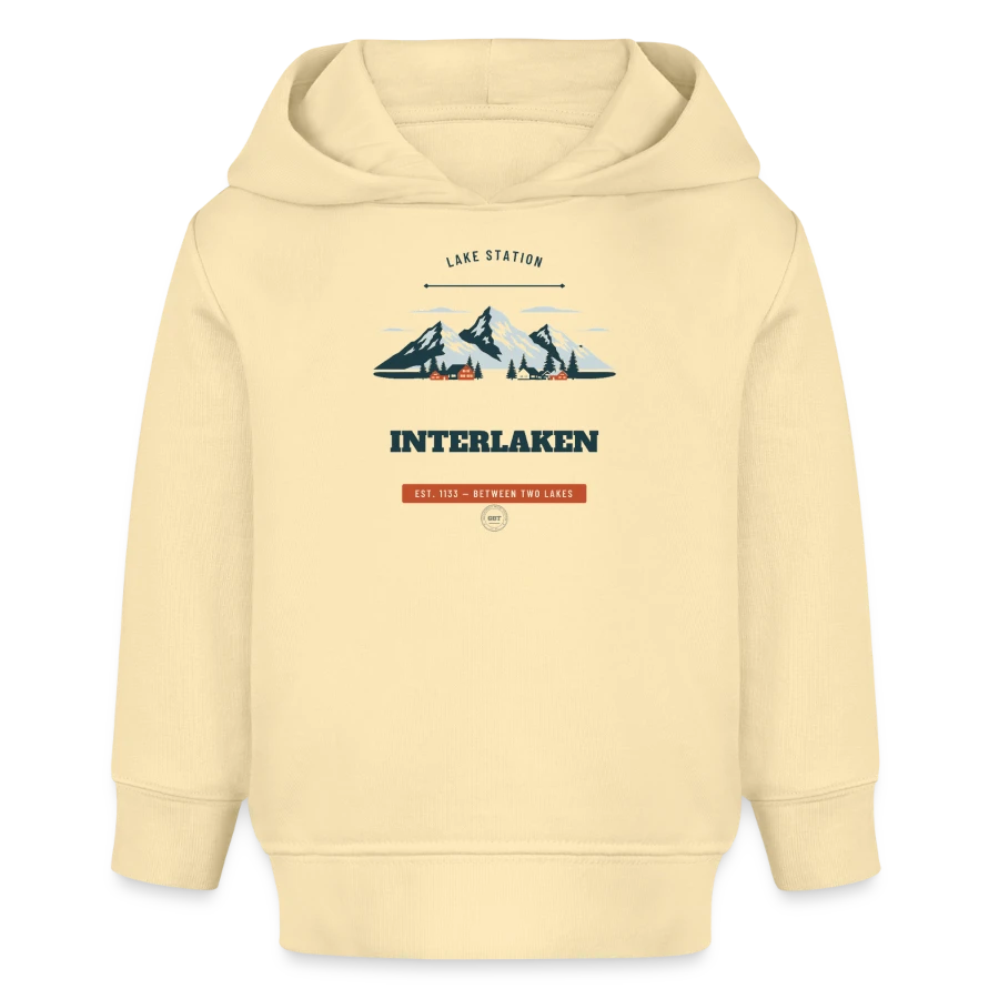 Interlaken badge on a baby organic hoodie by stanley/stella, cream
